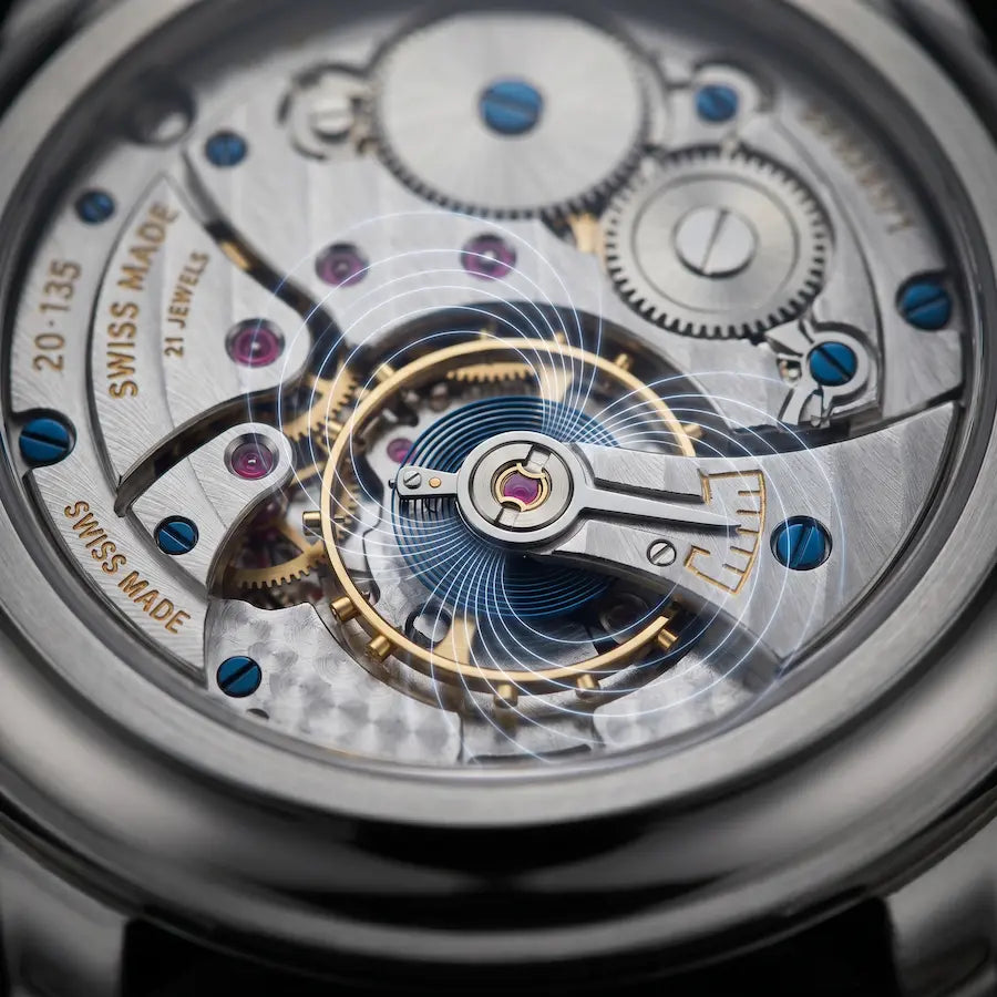 Gros plan sur le spiral d'une montre mécanique soumis à des mesures de précision chronométrique. Image